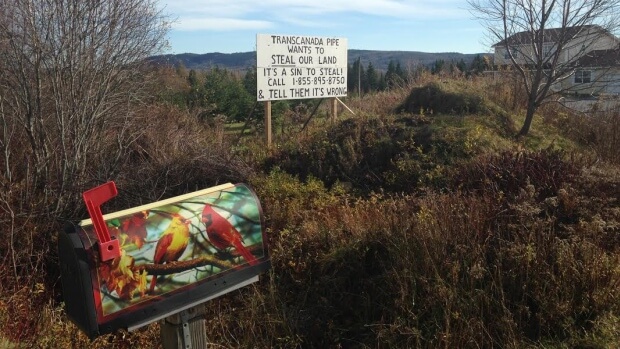 Rick Verge erected this sign to make it clear what his thoughts are on the proposed Energy East pipeline. (Matthew Bingley/CBC)