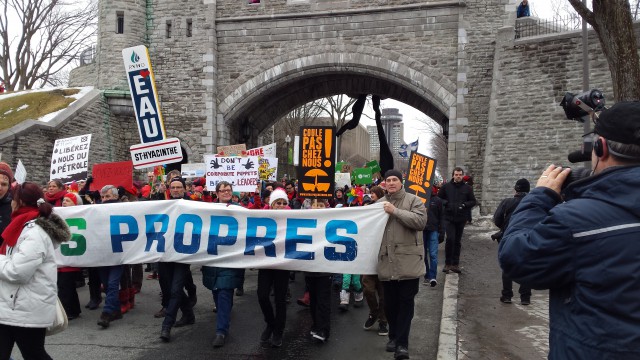 CCNB's Lois Corbett and Louise Comeau of Climate Action Network Canada pass through the gate to Old Quebec.