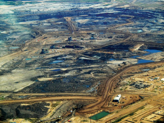 The oil sands in Alberta, a project so vast its impact on the natural environment can be seen from space.