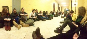 Divest MTA supporters stage a sit-in outside a MASU council meeting to protest their lack of support for divestment.
